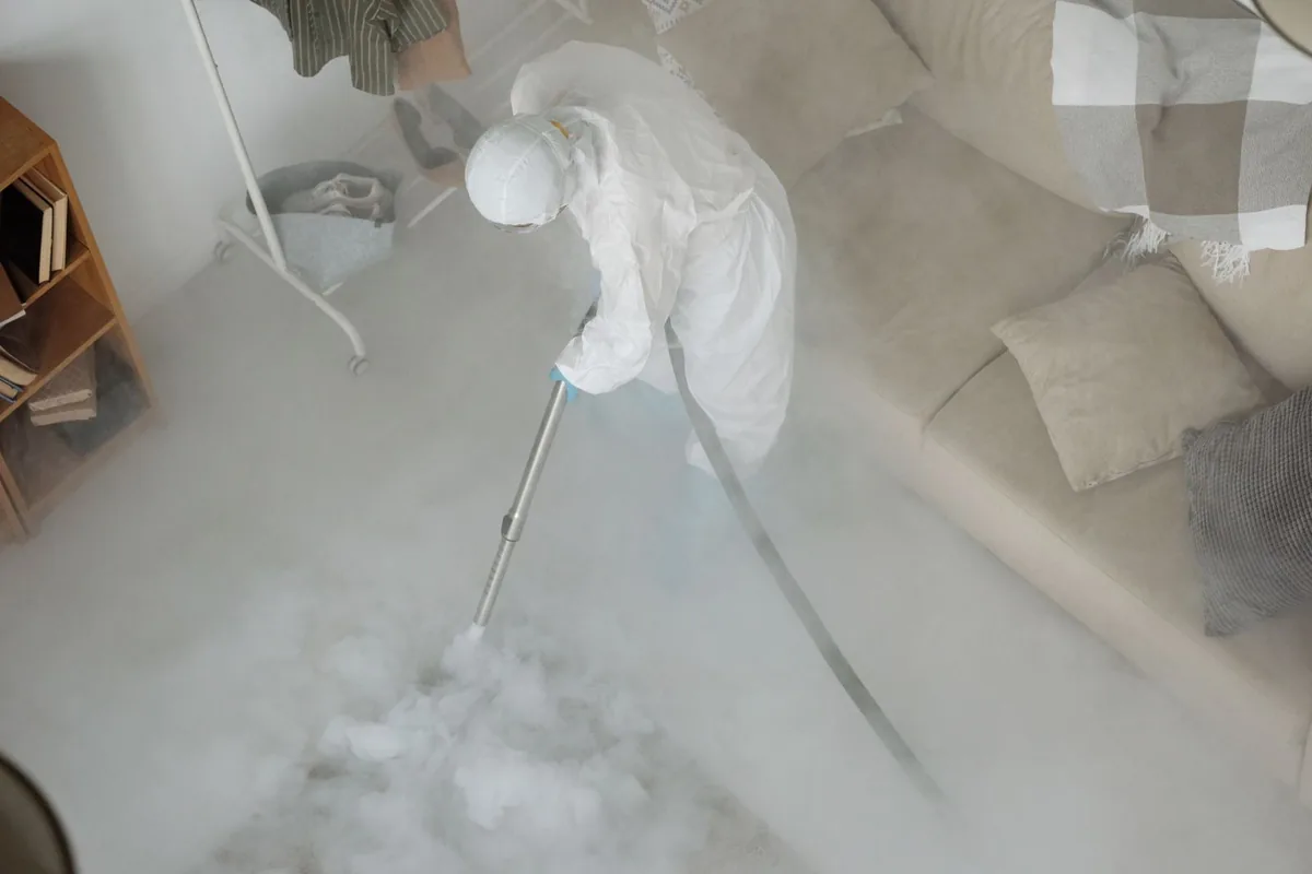 Biohazard cleanup technician in protective equipment, Berea, KY